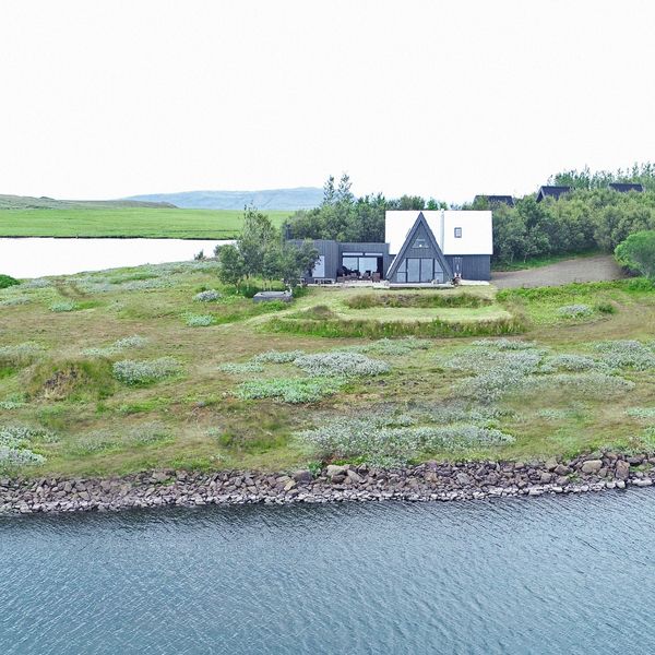 House with A-frame design near water