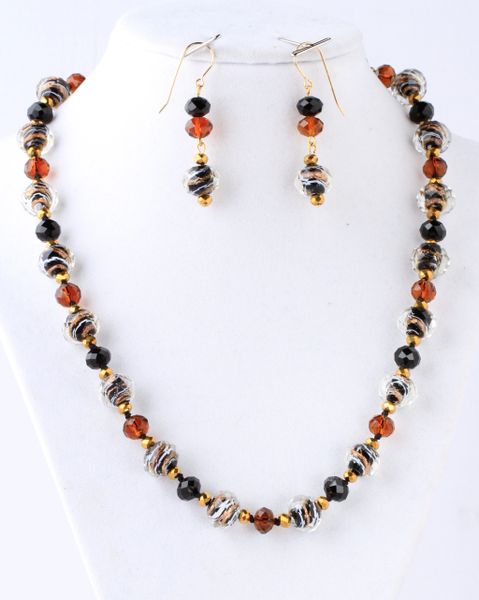 Amber-colored with black-gold-white mixed glass beads