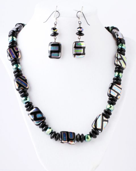 Metallic glass beads with black onyx spacers with green crystals