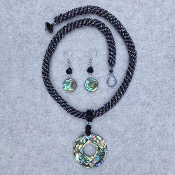 Abalone pendant with Russian spiral accent and black seed beads.