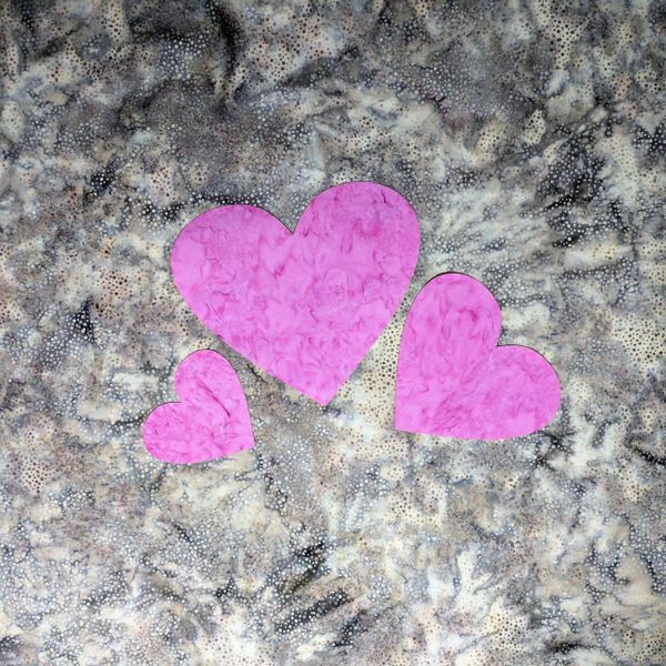 Set of three pink pre fused and laser cut heart appliques
