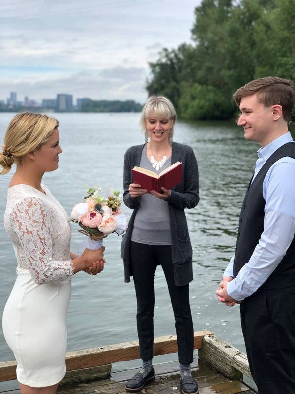 bride, groom & officiant on a floating dock.
copyright Monica Kennemer