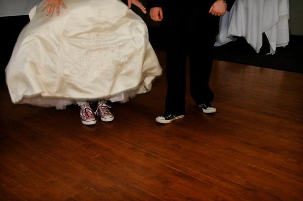 bride & groom's feet at reception.
copyright Erin Hardy Images