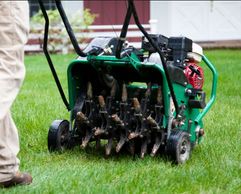 Lawn Care in Winnipeg. Lawn Aeration SErvice in winnipeg with spring cleanups and power raking turf.