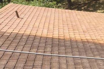 Shingle roof soft washing by Wizard pressure washing.