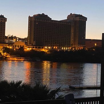 Harrahs casino lit up at night, perfect view from the beach and dock area