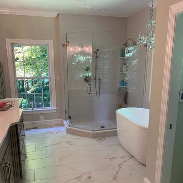 bathroom renovation and remodel. new tile, floors, shower glass, tub