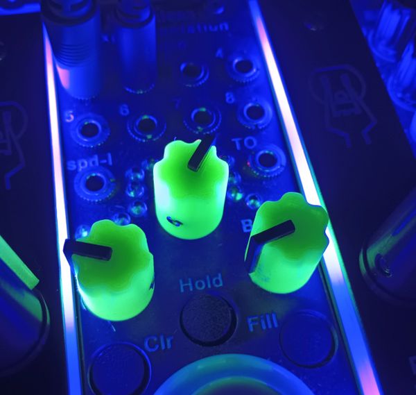 Green black light sensitive glow in the dark potentiometer knobs.