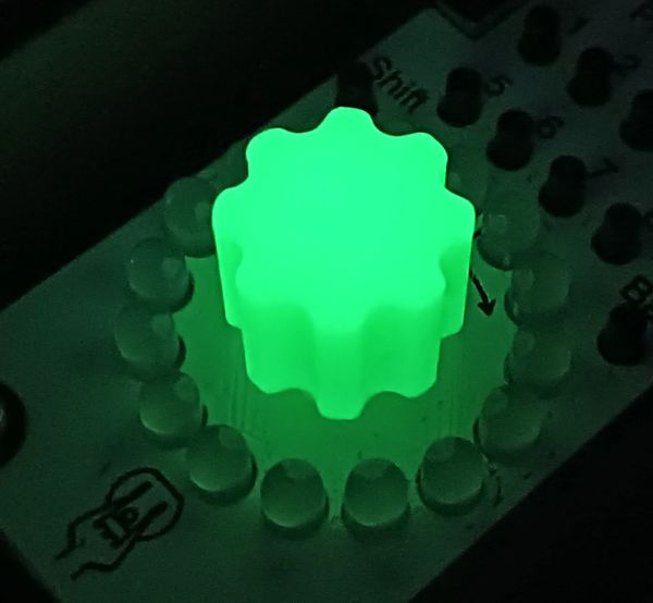 Green black light sensitive glow in the dark encoder knobs.