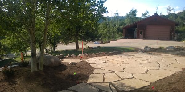 Flagstone patio being installed at a residence located in Steamboat Springs, CO.