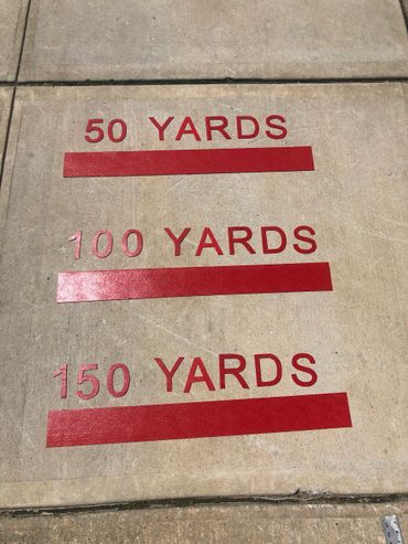 Red Preformed thermoplastic Distance markers on concrete by Surface Signs of NY