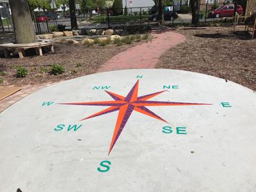 Preformed thermoplastic Compass Rose on concrete by surface signs of NY