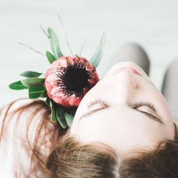 womans face with protea