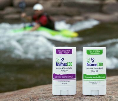 Kayaking on the Animas River Santa Rita whitewater park with Animas CBD therapeutic salve sticks.