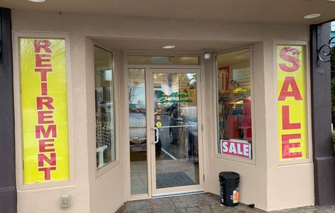 Printing wide-format retirement sale design with view-thru window perfs, from a local print shop