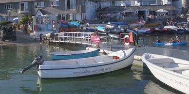 Image: a small boat for hire in the Helford River