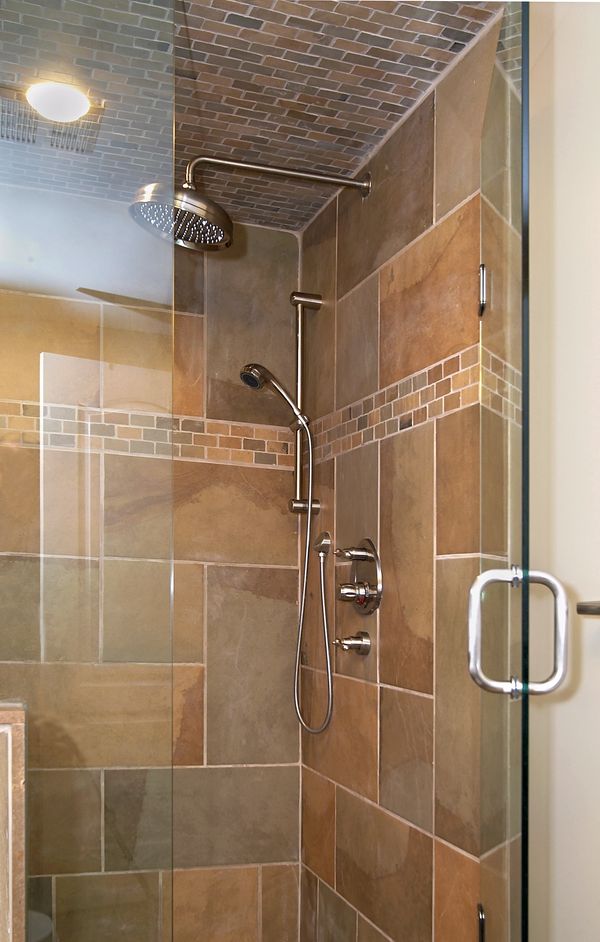 Shower with rain head, thermostatic valve, and hand held shower.