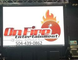 Video wall for On Fire Entertainment on truss rig for corporate rental.