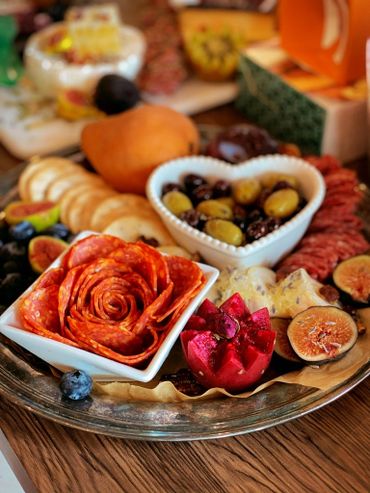 Charcuterie Board with an assortment of meat, cheese, and crackers.