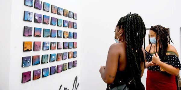 Guests view artwork at Salem on the Edge art gallery.