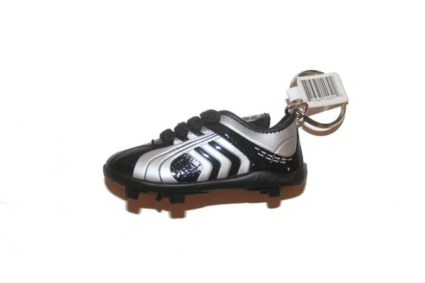 BLACK WHITE SHOE CLEAT KEYCHAIN .. NEW AND IN A PACKAGE