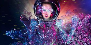 A woman in a futuristic transparent suit surrounded by colorful lights and bubbles.