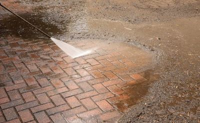 Pressure washing a block paving driveway