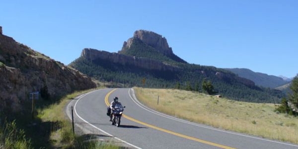 Motorcycle riding on a road with beautiful scenery