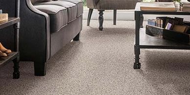 Luxury multi-color brown and tan wall to wall carpet in a family room.