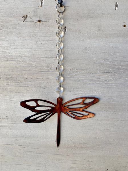 Hanging-Dragonfly dropped from a crystal strand