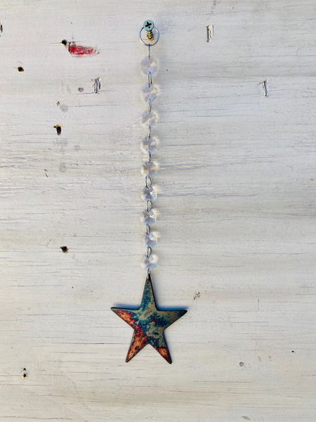 Hanging-Star hangs from crystal strand