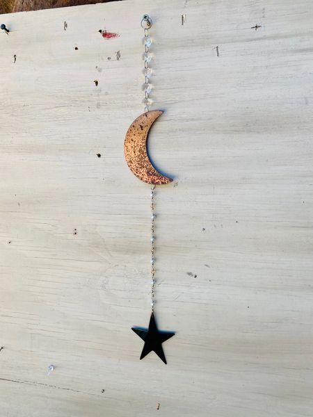 Hanging-Moon and star hangs from a crystal strand