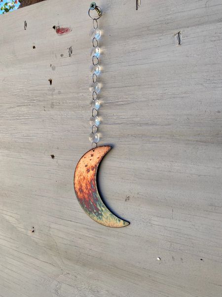 Hanging-Moon hangs from crystal strand