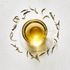 Silver Needle buds looseleaf and infused in a clear glass tea cup and saucer