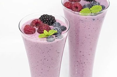 Creamy non-dairy protein shake made with frozen mixed berries, banan, almond milk, and almond butter