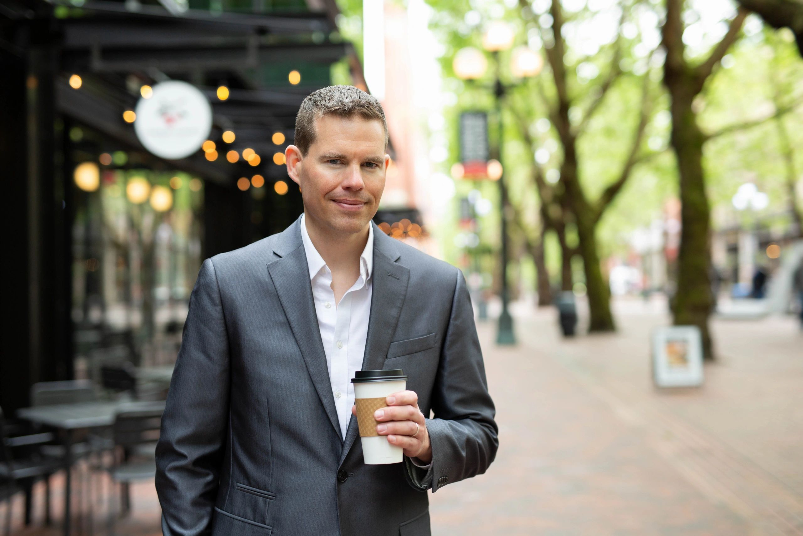 Brad Krueger holding a coffee cup