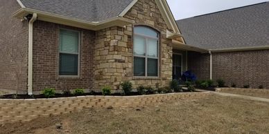 castlewall stones; flower beds; stone; retaining wall; shrubs; rock; curb appeal