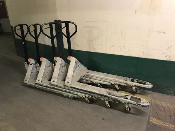 Set of 4 Crown Pallet Jacks - Includes delivery to Greater Boston. Model PTH50 27" x 48" - Used - Good Condition