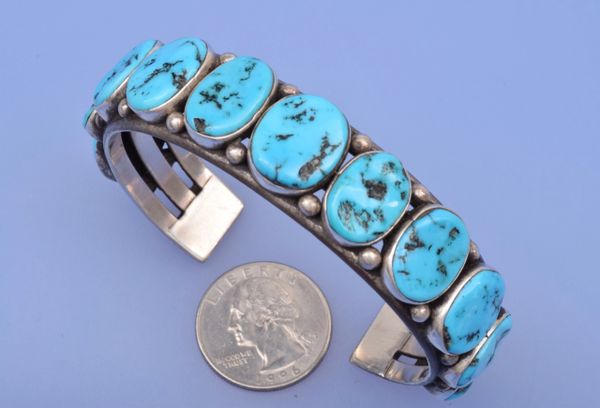 Larger wrist-size Navajo pawn cuff with eleven Sleeping Beauty turquoise stones. #0493
