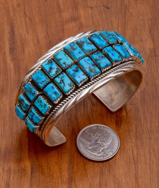 Dead-pawn Navajo Sterling cuff with 26 Sleeping Beauty rectangular turquoise stones.