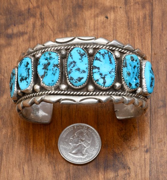 Dead-pawn Navajo classic Sterling cuff with seven Sleeping Beauty mine turquoise stones.