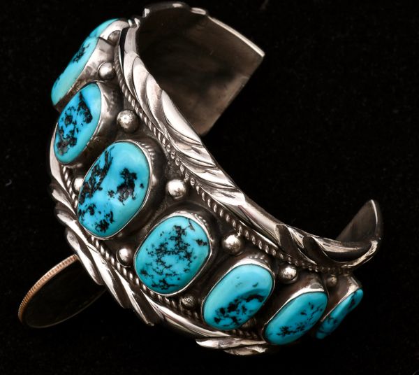 Dead-pawn Navajo Sterling row cuff with nine pristine Sleeping Beauty turquoise stones. #0979