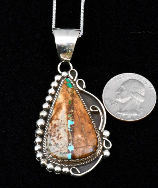 Medium-size Navajo Sterling Pendant with ribbon (boulder) turquoise. #1031