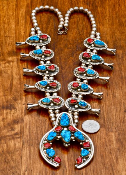 Intricate Navajo dead-pawn squash blossom necklace with Sleeping Beauty turquoise and Mediterranean red coral. #0646