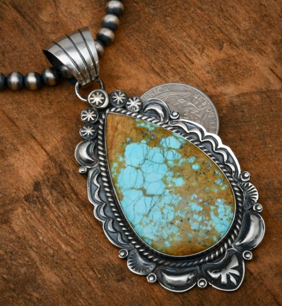 Robert Shakey' large teardrop-shaped old-style hand-stamped and reverse-stamped repousse' pendant with No. 8 Mine turquoise. SOLD! #1824