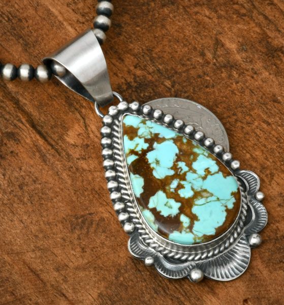 Mary Ann Spencer' No. 8 Mine turquoise Navajo pendant in old-style Sterling patina (shown with optional 4mm, 24-inch Sterling bead chain). #1932