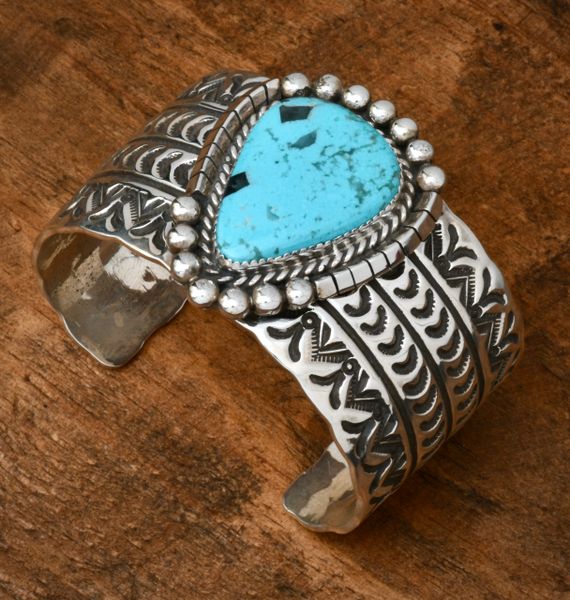 Wide, deep-stamped Ed and Betty Candelario Navajo cuff with Kingman turquoise. #1941
