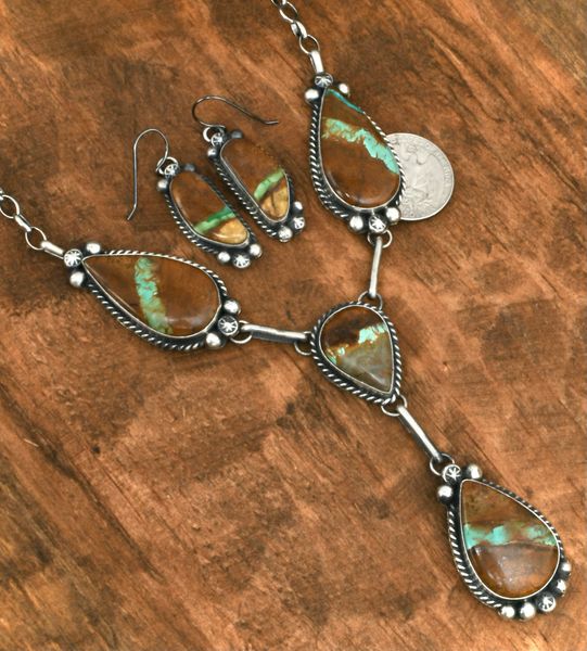 Six-stone ribbon turquoise pendant necklace and matching earrings, by Navajo artisan Augustine Largo. #2069