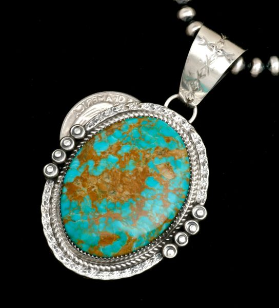 Oval turquoise pendant by Navajo artisan Phillip Yazzie. #2319a