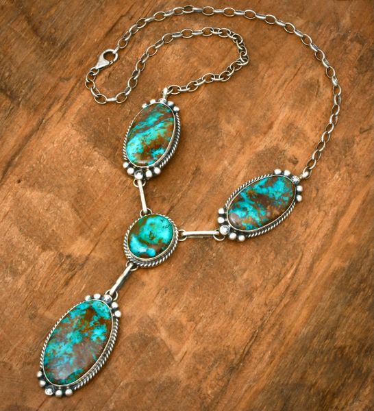 Four-stone turquoise pendant necklace by Navajo artisan Augustine Largo. #2238a